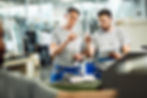 industrial-workers-cooperating-while-doing-quality-control-manufactured-products-factory.j